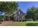 Charming brick home with well-maintained landscaping and a covered front porch at 1892 Raven Hill Ne Dr, Atlanta, GA 30319