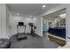 Spacious gym equipped with a treadmill, stationary bike, and rubber flooring, perfect for home workouts at 1892 Raven Hill Ne Dr, Atlanta, GA 30319