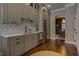 Charming kitchen features light gray cabinetry, stainless appliances, white countertops, and hardwood flooring at 1892 Raven Hill Ne Dr, Atlanta, GA 30319