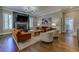 Spacious living room boasts stone fireplace, recessed lighting, and plantation shutters for natural light at 1892 Raven Hill Ne Dr, Atlanta, GA 30319