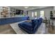Stylish living room with blue sofa, custom built-ins, and backyard view at 1892 Raven Hill Ne Dr, Atlanta, GA 30319