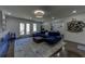 Expansive living area with a large sectional, an ottoman, and access to the outdoors at 1892 Raven Hill Ne Dr, Atlanta, GA 30319
