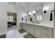 Modern main bathroom features dual sinks, plenty of storage, and marble floors at 1892 Raven Hill Ne Dr, Atlanta, GA 30319