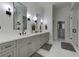 Modern main bathroom features dual sinks, plenty of storage, and marble floors at 1892 Raven Hill Ne Dr, Atlanta, GA 30319