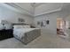 This main bedroom is bright with trey ceilings and a large gray bed at 1892 Raven Hill Ne Dr, Atlanta, GA 30319