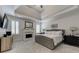 This main bedroom is bright with trey ceilings and includes a fireplace and a large gray bed at 1892 Raven Hill Ne Dr, Atlanta, GA 30319