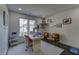 Bright office space featuring a modern desk, sitting area, and ample natural light from a large window at 1892 Raven Hill Ne Dr, Atlanta, GA 30319