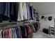 Large walk-in closet with hanging racks and shelving for optimal organization at 1892 Raven Hill Ne Dr, Atlanta, GA 30319