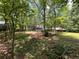 Expansive backyard with mature trees, offering privacy and shade at 3262 Bluff Rd, Marietta, GA 30062