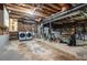 Unfinished basement featuring exposed ceiling beams and duct work with washer and dryer at 3262 Bluff Rd, Marietta, GA 30062