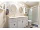 Well-lit bathroom with double sinks, a walk-in shower, and neutral décor at 3262 Bluff Rd, Marietta, GA 30062