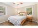 Welcoming bedroom with hardwood floors, a light wood bed frame, and bright windows at 3262 Bluff Rd, Marietta, GA 30062