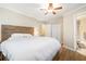 Comfortable bedroom with hardwood floors, a ceiling fan, and a neutral color scheme at 3262 Bluff Rd, Marietta, GA 30062