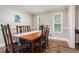 Traditional dining room featuring hardwood floors, and natural light at 3262 Bluff Rd, Marietta, GA 30062