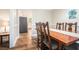 Traditional dining room featuring hardwood floors and adjoining kitchen area at 3262 Bluff Rd, Marietta, GA 30062