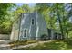 Two-story home with a well manicured lawn, attached two car garage, and lush surroundings at 3262 Bluff Rd, Marietta, GA 30062