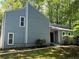 Charming house with a well-manicured lawn and light blue exterior siding at 3262 Bluff Rd, Marietta, GA 30062