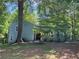 Charming home exterior featuring mature trees and a landscaped yard at 3262 Bluff Rd, Marietta, GA 30062