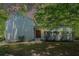 Inviting front facade with lush greenery and mature trees at 3262 Bluff Rd, Marietta, GA 30062