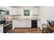 Modern kitchen featuring white cabinetry, stainless appliances, and granite counters at 3262 Bluff Rd, Marietta, GA 30062