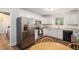 Modern kitchen with stainless steel appliances and a cozy breakfast nook at 3262 Bluff Rd, Marietta, GA 30062