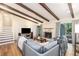 Inviting living room with wood floors, fireplace, exposed beam ceilings, and comfortable seating at 3262 Bluff Rd, Marietta, GA 30062