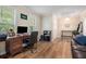 Well-lit office with wood floors, a desk, and a comfortable leather couch at 3262 Bluff Rd, Marietta, GA 30062