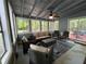 Comfortable sunroom with neutral-toned furnishings and plenty of windows at 3262 Bluff Rd, Marietta, GA 30062