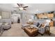 Open concept living room featuring plush seating and breakfast bar to the kitchen at 360 Parkview Manor Dr, Tucker, GA 30084