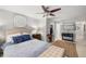 Bright main bedroom with a ceiling fan, decorative art, and walk-in closet access at 360 Parkview Manor Dr, Tucker, GA 30084