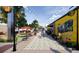 Charming street view with shops, outdoor seating, and decorative string lights in a commercial area at 360 Parkview Manor Dr, Tucker, GA 30084