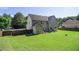 Large backyard with a patio area, offering ample space for outdoor living and entertaining at 4765 Smokestone Dr, Douglasville, GA 30135
