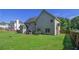 Backyard features a lush lawn, patio area with furniture, and a privacy fence at 4765 Smokestone Dr, Douglasville, GA 30135