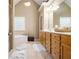 Bright bathroom featuring a soaking tub, double vanity, and neutral finishes at 4765 Smokestone Dr, Douglasville, GA 30135