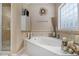 A stylish bathroom with a large soaking tub and a separate glass-enclosed shower at 4765 Smokestone Dr, Douglasville, GA 30135