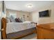 Cozy bedroom with soft lighting, comfortable bed, and a mounted television for ultimate relaxation at 4765 Smokestone Dr, Douglasville, GA 30135