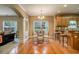 Cozy dining area featuring hardwood floors, elegant lighting, and seamlessly connecting with adjacent living spaces at 4765 Smokestone Dr, Douglasville, GA 30135