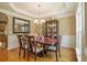 Dining room with wood floors, six chairs, table and chandelier lighting, perfect for Gathering gatherings at 4765 Smokestone Dr, Douglasville, GA 30135
