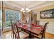 Sunlit dining room showcases a large window and a classic table setting at 4765 Smokestone Dr, Douglasville, GA 30135