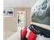 Home gym featuring a futon, treadmill, punching bag, and beach themed art at 4765 Smokestone Dr, Douglasville, GA 30135