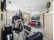 Bright exercise room featuring an elliptical, treadmill, mounted television, and comfortable seating, ideal for a home gym at 4765 Smokestone Dr, Douglasville, GA 30135