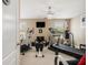 Home gym featuring an elliptical, treadmill, bench, punching bag, and natural light at 4765 Smokestone Dr, Douglasville, GA 30135