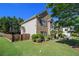 Two-story brick home with a manicured lawn and mature trees, providing curb appeal at 4765 Smokestone Dr, Douglasville, GA 30135