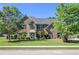 Stately brick home with well-manicured lawn, mature trees and inviting curb appeal at 4765 Smokestone Dr, Douglasville, GA 30135