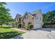 Spacious home with a brick facade, two-car garage, and a lovely green lawn at 4765 Smokestone Dr, Douglasville, GA 30135