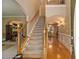 Inviting foyer featuring a staircase, hardwood floors, and elegant decor at 4765 Smokestone Dr, Douglasville, GA 30135