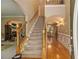 Inviting foyer with hardwood floors and staircase leading to the second floor, with lots of natural light at 4765 Smokestone Dr, Douglasville, GA 30135