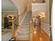 Welcoming foyer with a staircase, hardwood floors, and elegant lighting at 4765 Smokestone Dr, Douglasville, GA 30135
