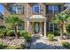 Welcoming front entrance with lush landscaping, stone accents, and covered porch at 4765 Smokestone Dr, Douglasville, GA 30135