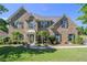 Stately brick home featuring a landscaped front yard and a welcoming entrance at 4765 Smokestone Dr, Douglasville, GA 30135